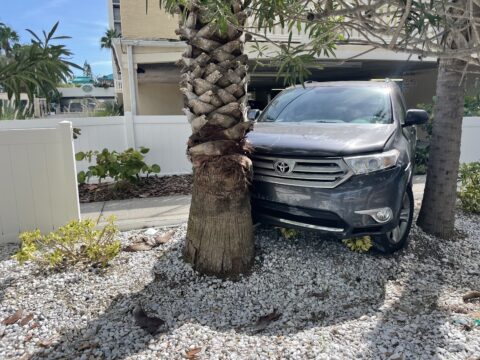 cars drive through parking garage
